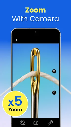 Lupa zoom camera feature displaying gold jewelry clasp magnified x5 with zoom controls and camera settings