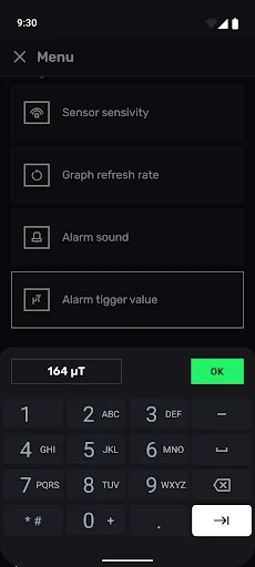 Alarm trigger value settings screen with numeric keypad input showing 164 µT threshold for EMF detection alerts and sensitivity